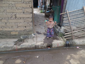 Full length portrait of girl playing