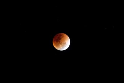 Scenic view of moon against clear sky at night