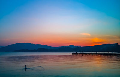 Scenic view of sea against sky during sunset