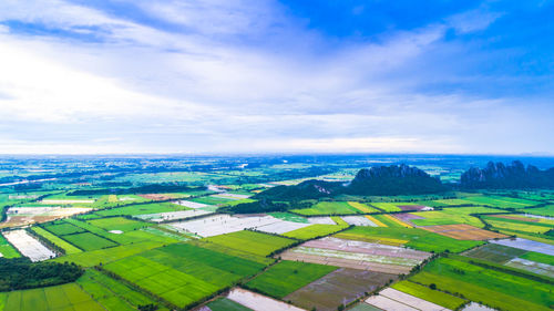 Aerial view of agricultural field against sky