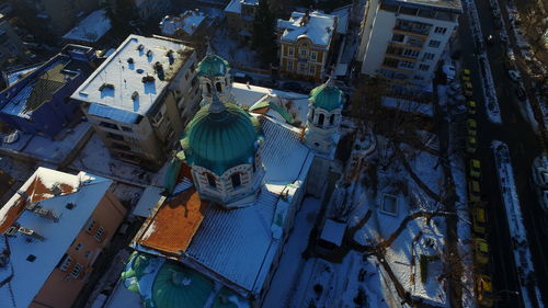 High angle view of church and buildings in city