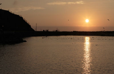 Scenic view of sea against sky during sunset