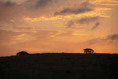 Scenic view of silhouette landscape against sky during sunset