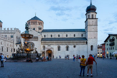 Group of people in front of building against sky