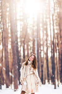 Woman in forest during winter