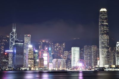 Illuminated buildings in city at night