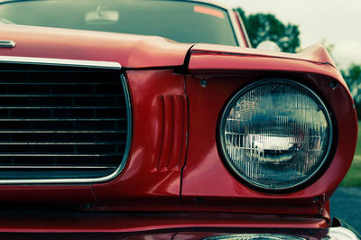 Reflection of a car on side-view mirror