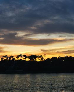 Scenic view of sea against orange sky