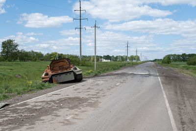 Cars on road against sky