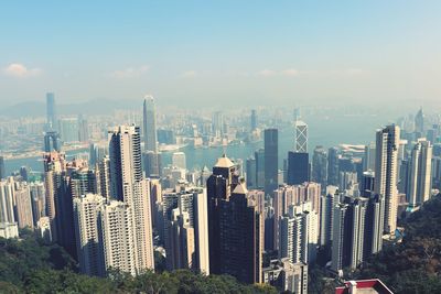 Panoramic view of modern buildings in city against sky