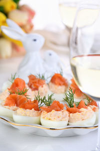 Appetizer of eggs stuffed salmon pate and yolks with salmon slices. idea easter table