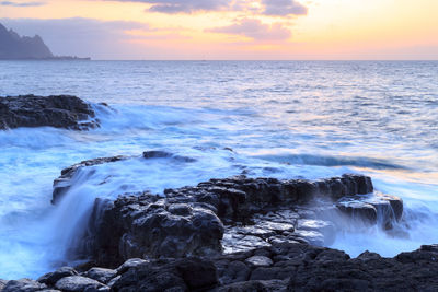 Scenic view of sea against sky during sunset