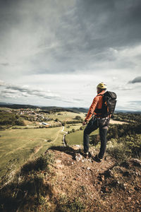 Man on field against sky
