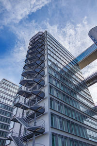 Low angle view of skyscraper against sky