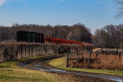 Train on railroad track against clear sky