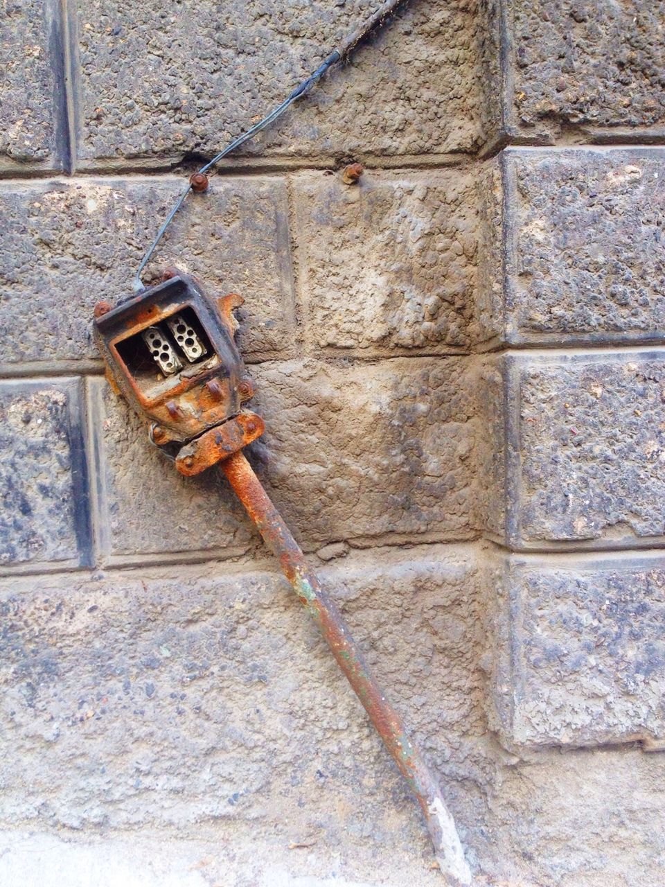 wall - building feature, brick wall, built structure, architecture, metal, building exterior, old, wall, outdoors, day, close-up, weathered, no people, rusty, safety, textured, abandoned, communication, protection, security