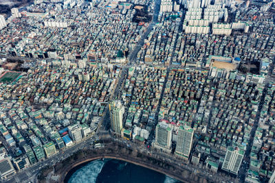 High angle view of crowd on road against buildings