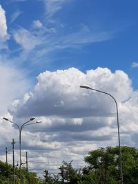 Low angle view of street light against sky