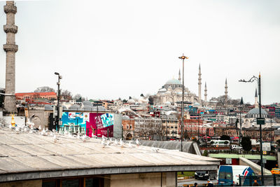 View of buildings in city against clear sky