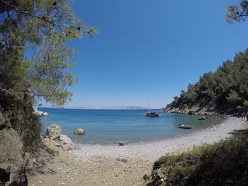 Scenic view of sea against clear blue sky