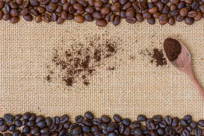 High angle view of coffee beans on burlap
