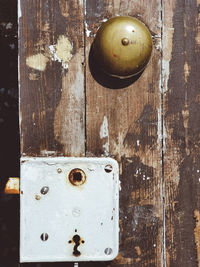 Close-up of old door handle on table
