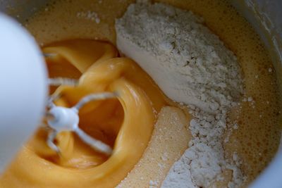 Cropped image of electric beater mixing batter