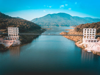 Scenic view of river against cloudy sky