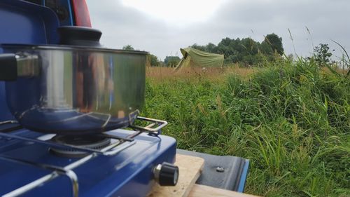 Tractor on field against sky