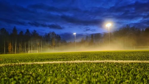 Scenic view of field against sky at night