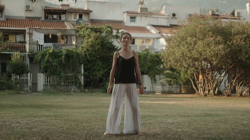 Rear view of woman standing in park