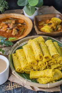 Malaysian traditional dish called net pancake or roti jala served with lamb or mutton curry.