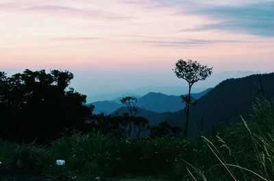 Scenic view of silhouette mountains against sky at sunset