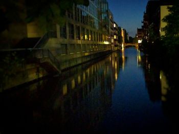 Illuminated buildings in city at night