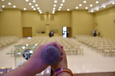 Close-up of woman hand in illuminated stage