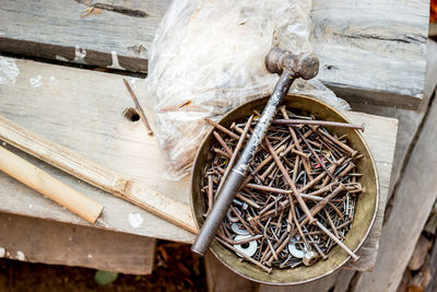 High angle view of old metal structure on wooden floor