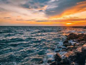 Scenic view of sea against sky during sunset