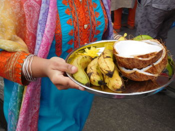 Midsection of woman holding food