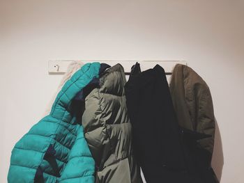 Rear view of people against wall in winter