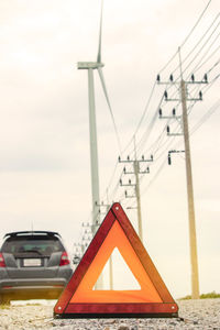 Close-up of triangle shape against car