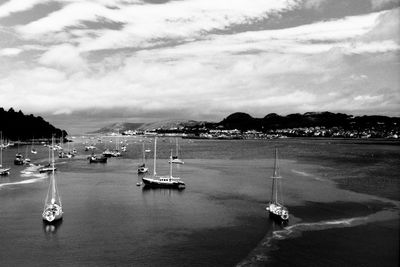 High angle view of boats in sea against sky