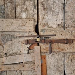Close-up of locked old wooden door