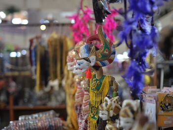 Close-up of clothes hanging in store for sale