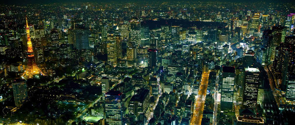 Tokyo, japan modern urban skyline at night overlooking the tower.