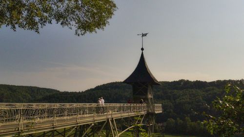 Built structure on landscape against sky