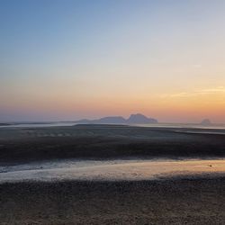 Scenic view of beach during sunset