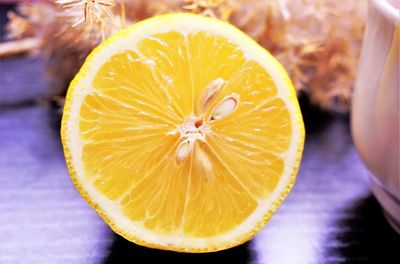 Close-up of orange slice on table