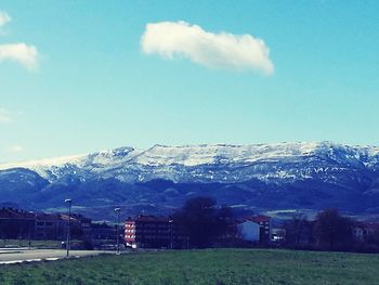 Scenic view of snowcapped mountains against sky