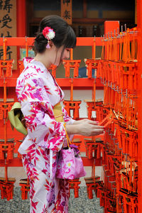 Woman standing in traditional clothing