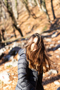 Portrait of a girl in the forest in winter